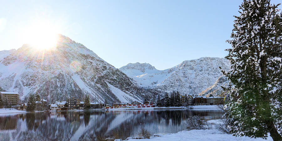 Admire the scenery on a beautiful train journey to a lakeside mountain town